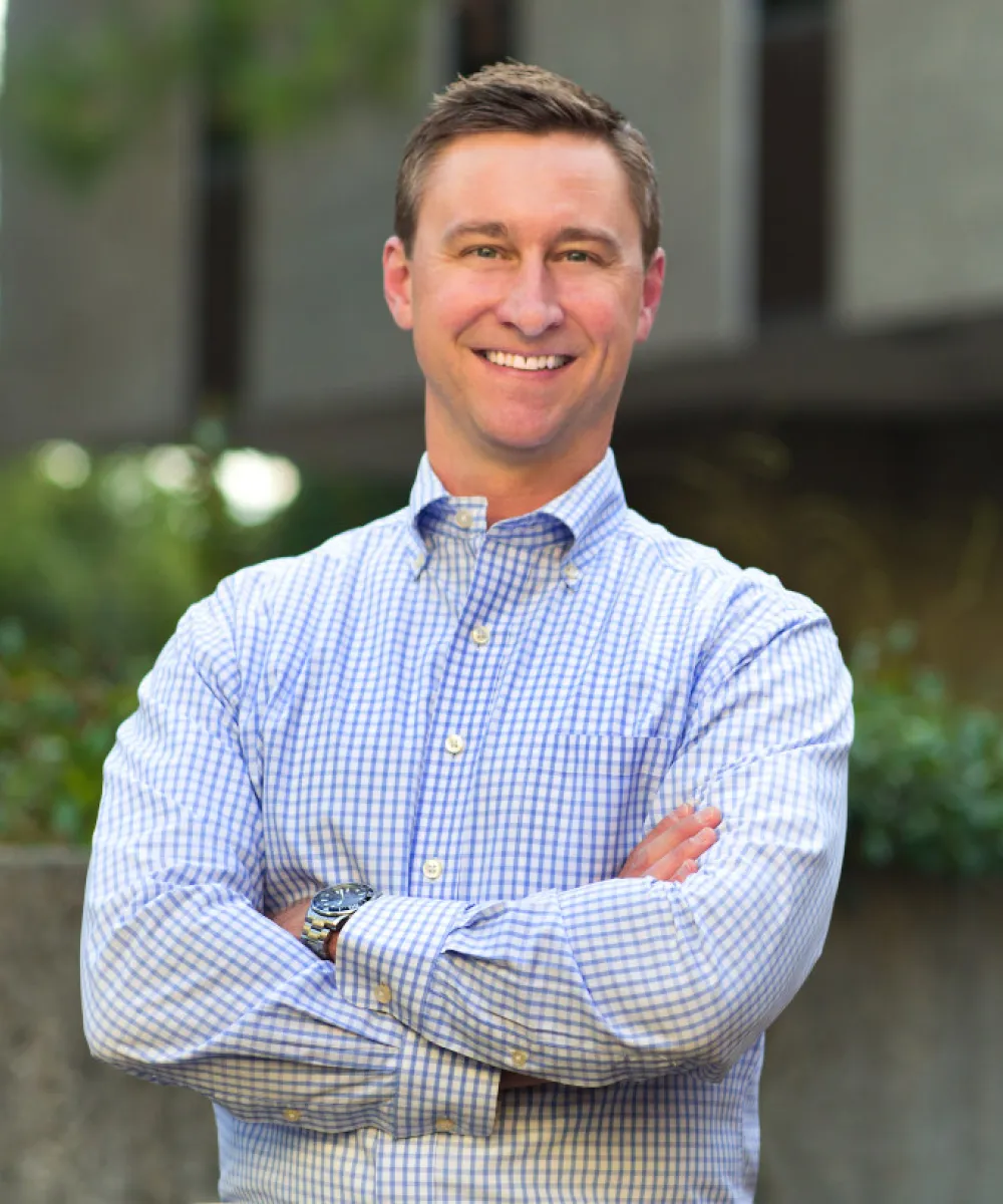 Travis Reid | Founder & CIO | Kauzer Capital Management